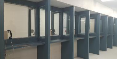link to full image of County Jail visitor area with phones